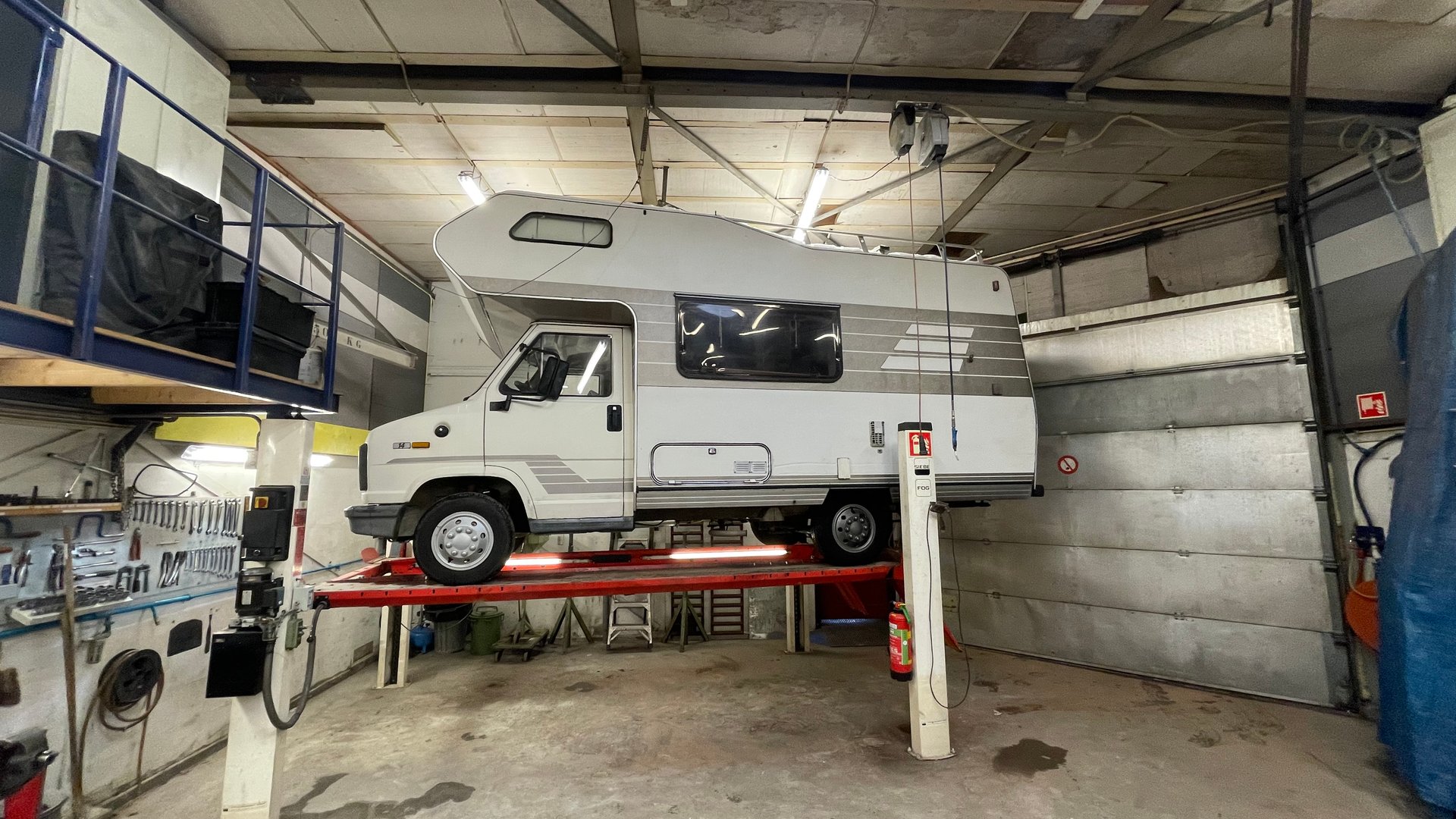 Van conversion in progress with tools and timber